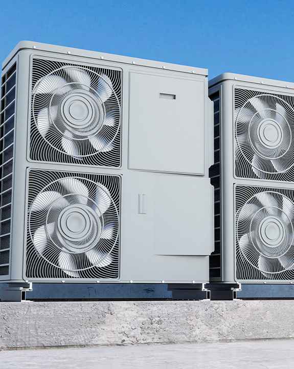 Two large outdoor air conditioning units, expertly installed on a concrete platform, stand ready under a clear blue sky—perfect for reliable cooling and easy access during any ac repair.